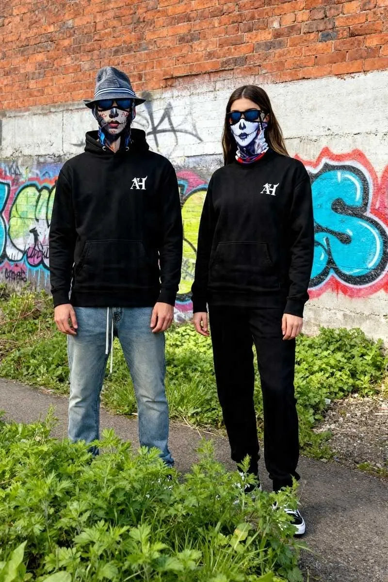 Albert Harry AH Minimal Dire Wolf Clan Royal Seal hoodie worn by Sun Walker and Spirit Walker with black wolf at Manchester graffiti location — UK street culture fashion 2026