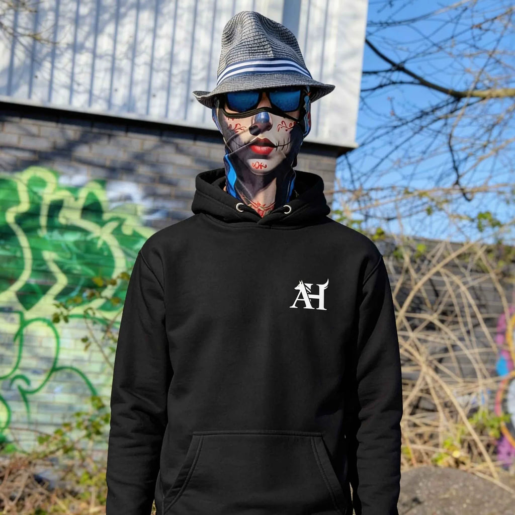 The Sun Walker wearing an Albert Harry AH Minimal Dire Wolf Clan Royal Seal fashion hoodie in a Manchester graffiti location.