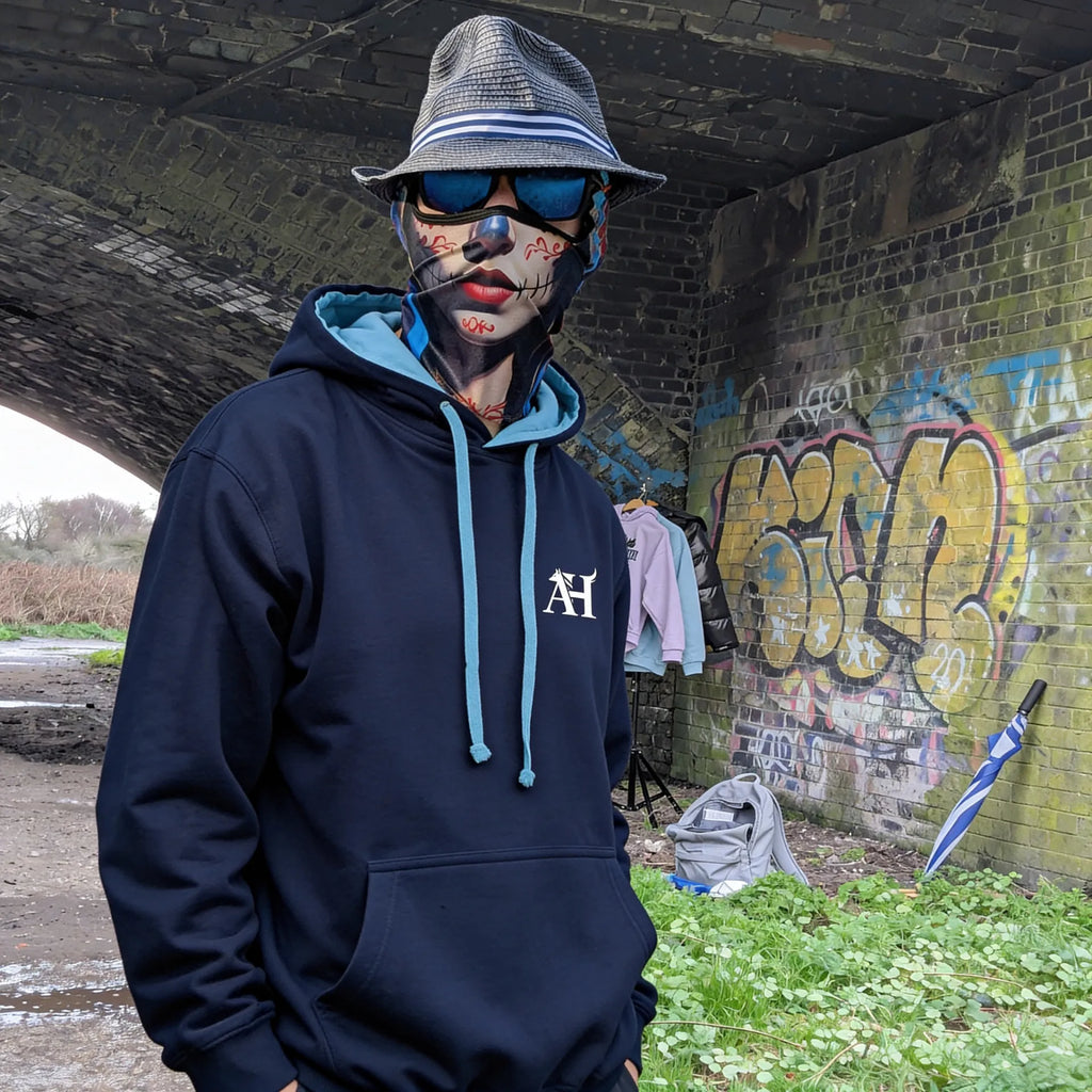 The Sun Walker wearing Albert Harry AH Minimal La Brea Wolf fashion hoodie in UK graffiti Train Tunnel location.