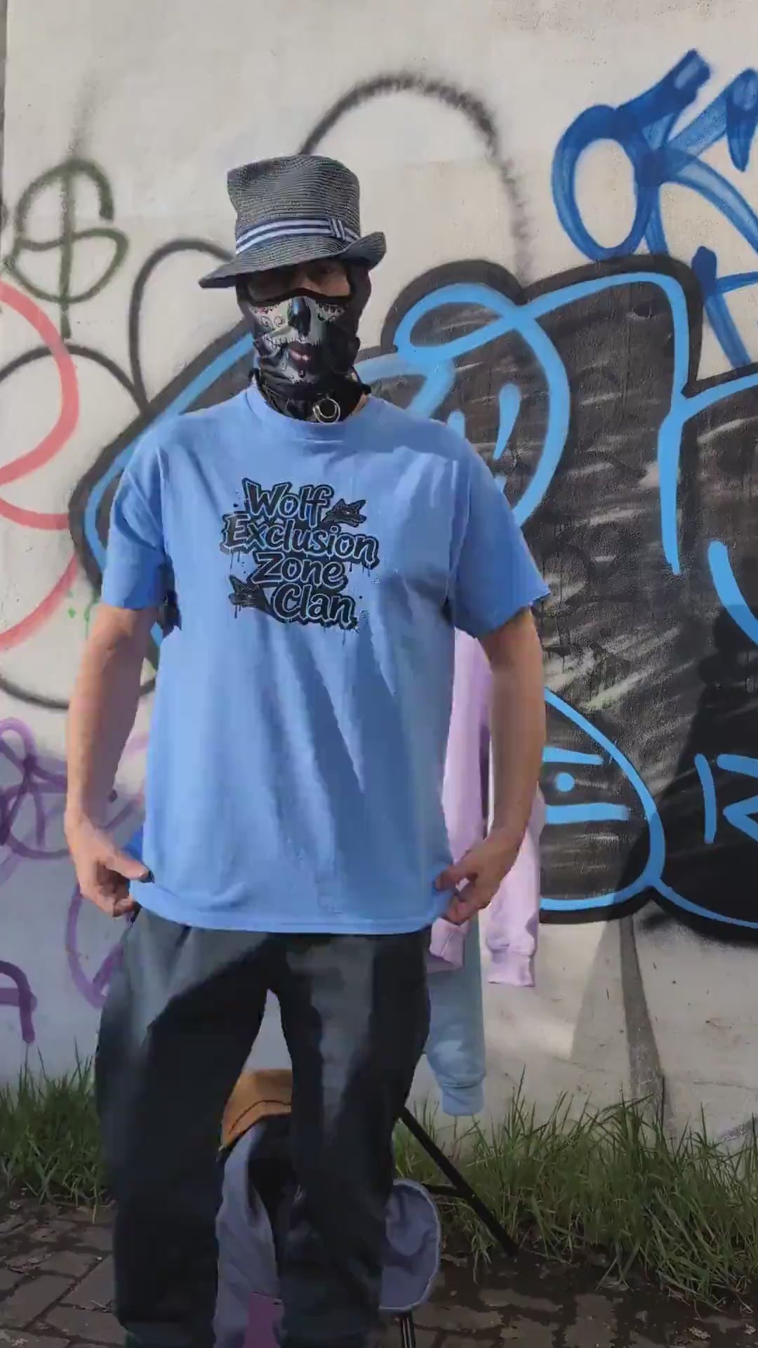 The Sun Walker wearing Albert Harry AH Minimal La Brea Wolf fashion hoodie in Manchester graffiti subway location.
